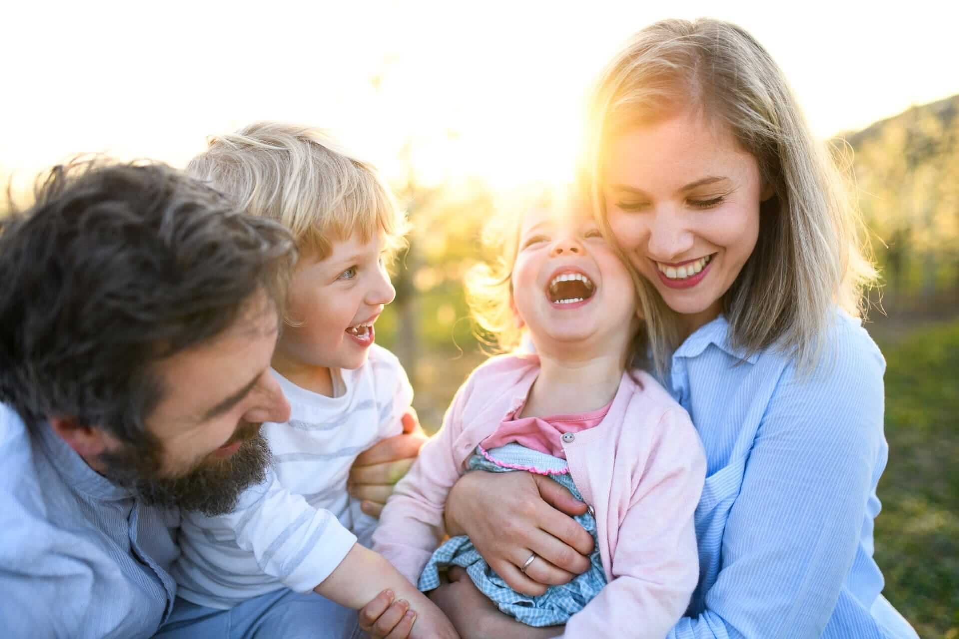 family of 4 outside smiling, benefits of health cover