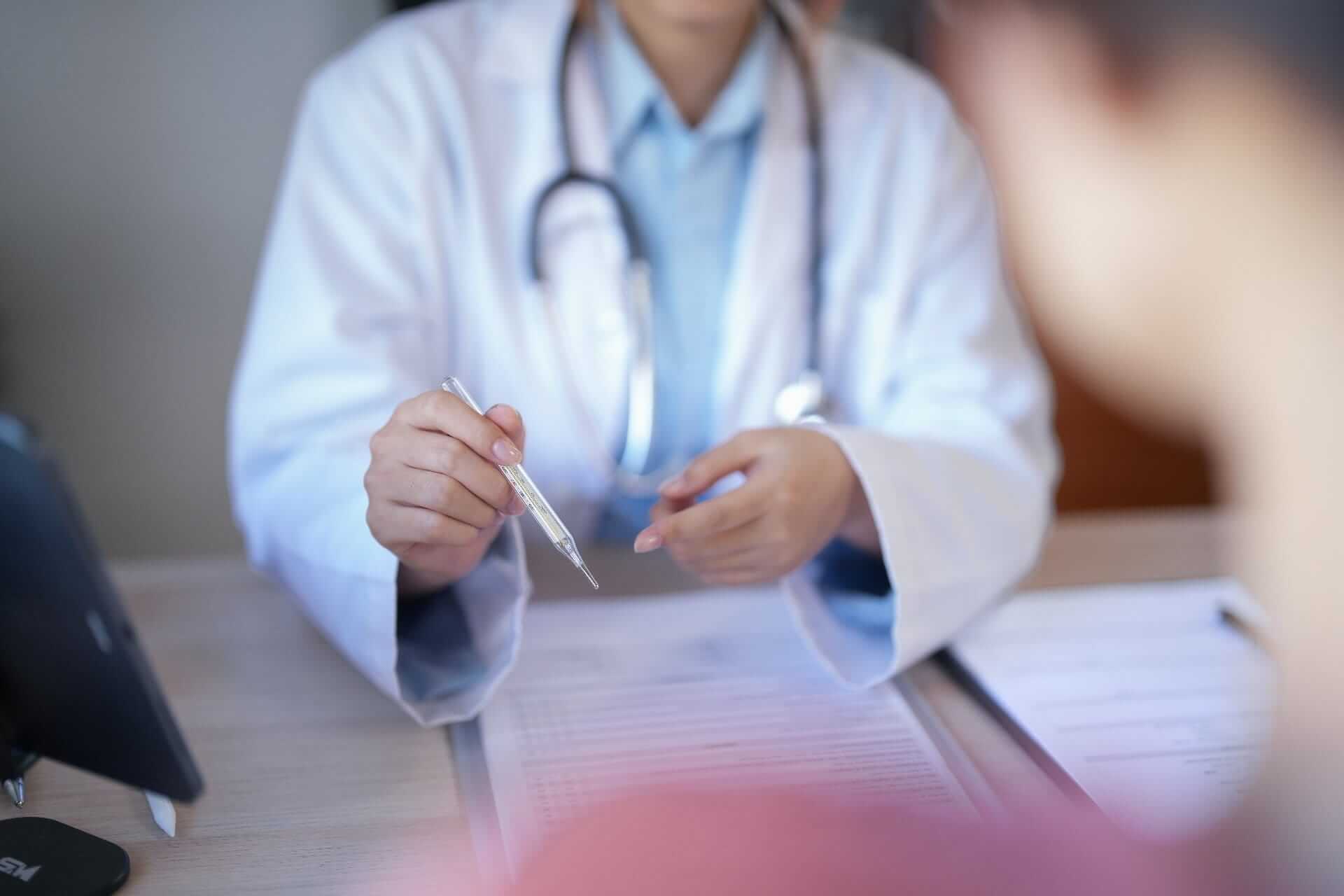 Doctor explaining paperwork to a patient during a private health care appointment